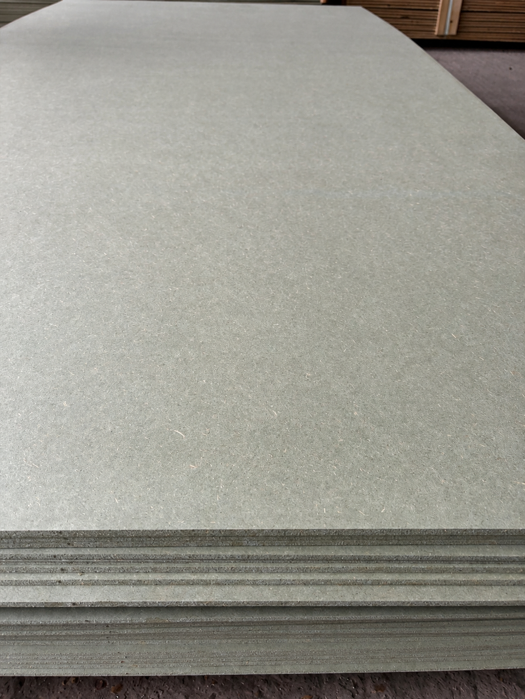 Moisture resistant MDF sheets, 2440 x 1220mm, stacked at Tendring Lumber Company