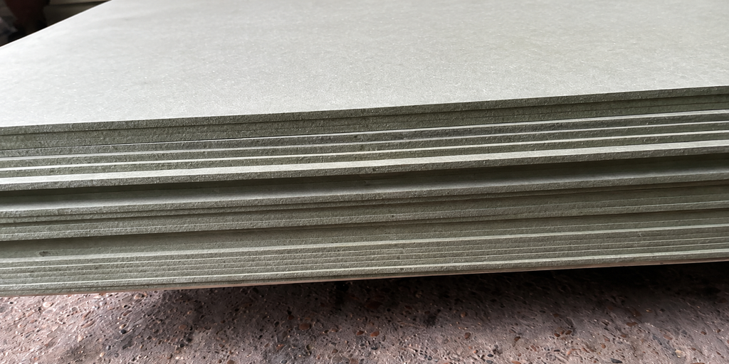 Close-up of stacked moisture resistant MDF sheet edges