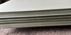 Close-up of stacked moisture resistant MDF sheet edges